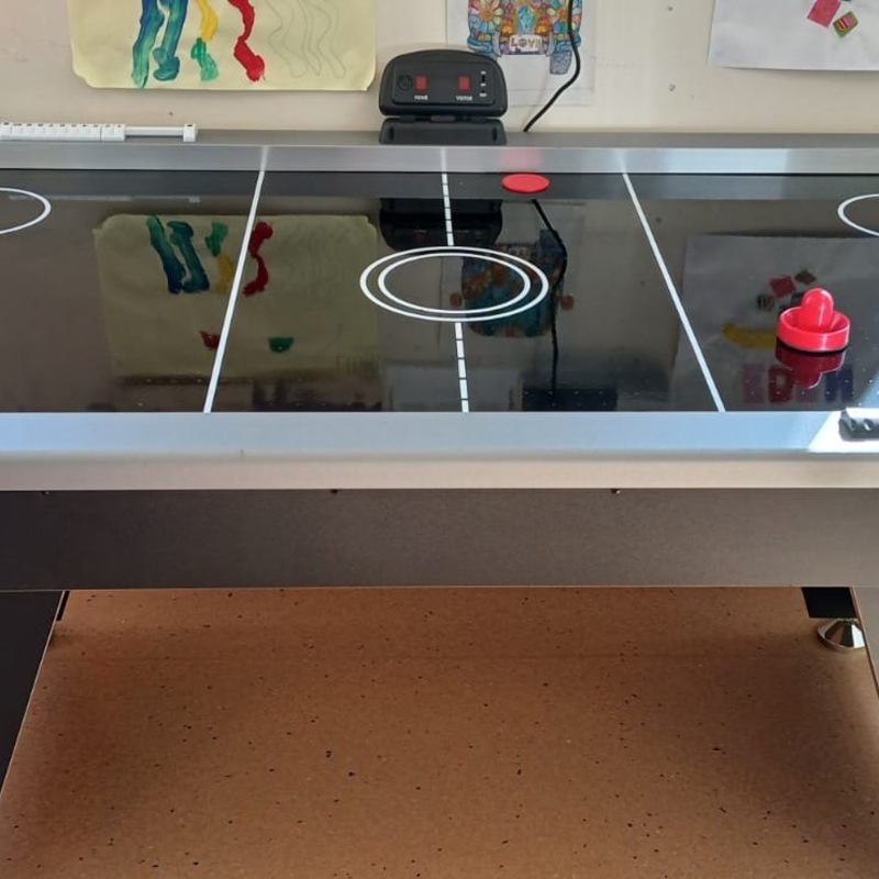 We replaced the playroom's air hockey table in April 2025.